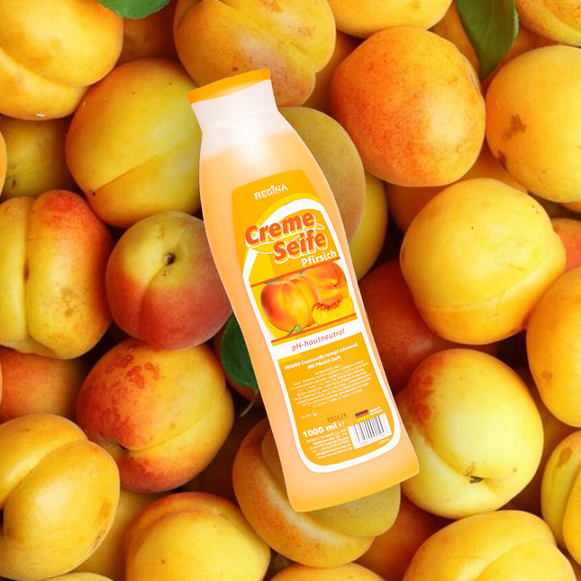 Regina Cremeseife Pfirsich, 1000 ml Flasche, pH-hautneutral, vor Aprikosen-Hintergrund platziert

